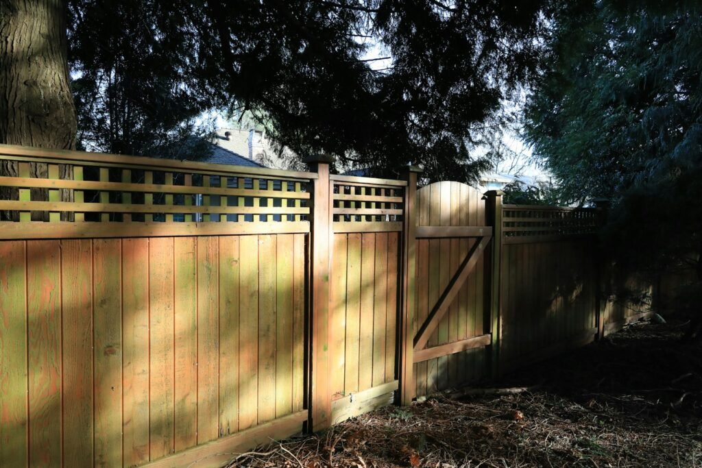 Wood fence with a gate and lattice top